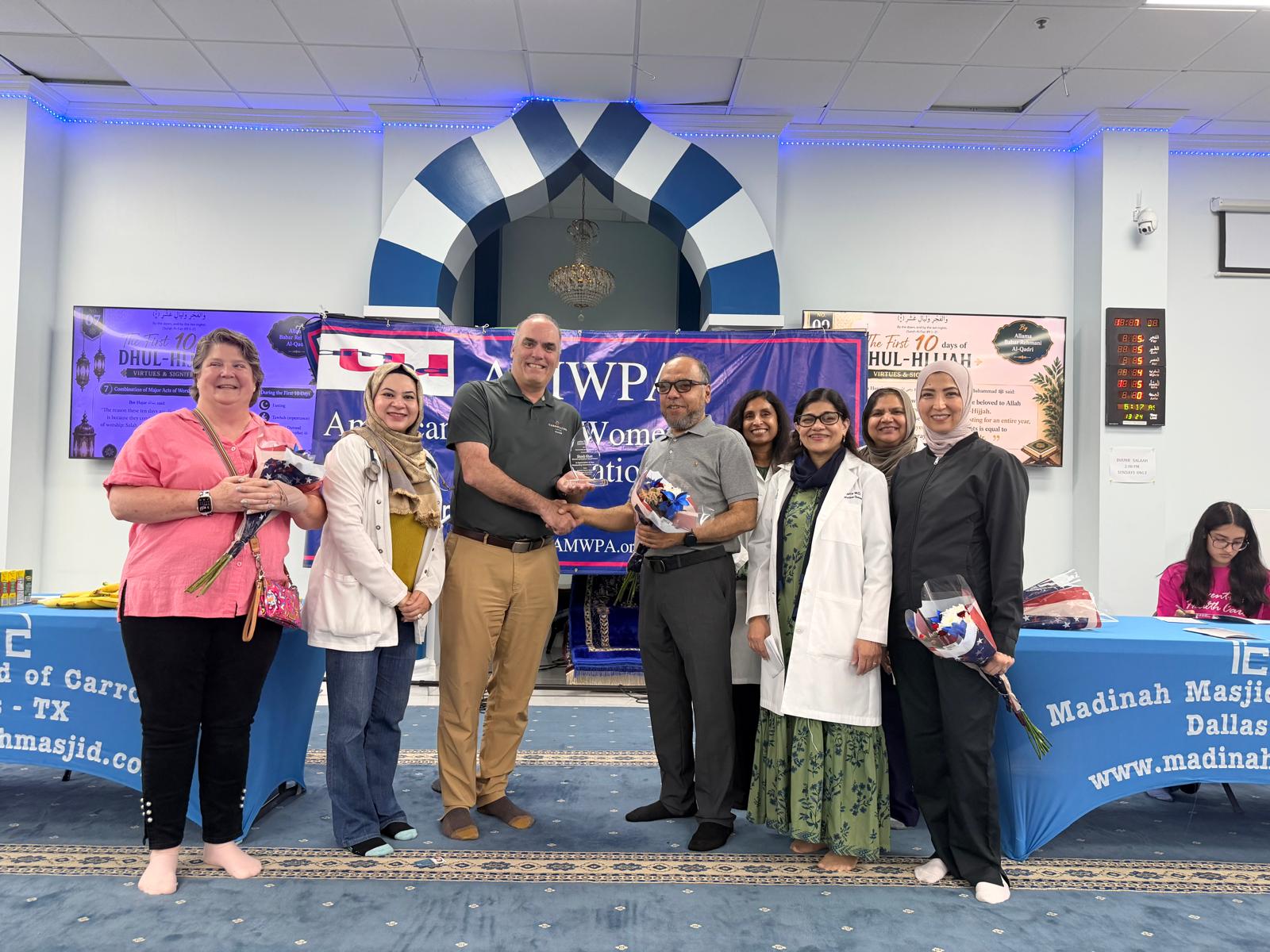 Mayor Steve Babick of Carrollton presenting an award to the volunteer physician team at the May 16, 2026 community health fair