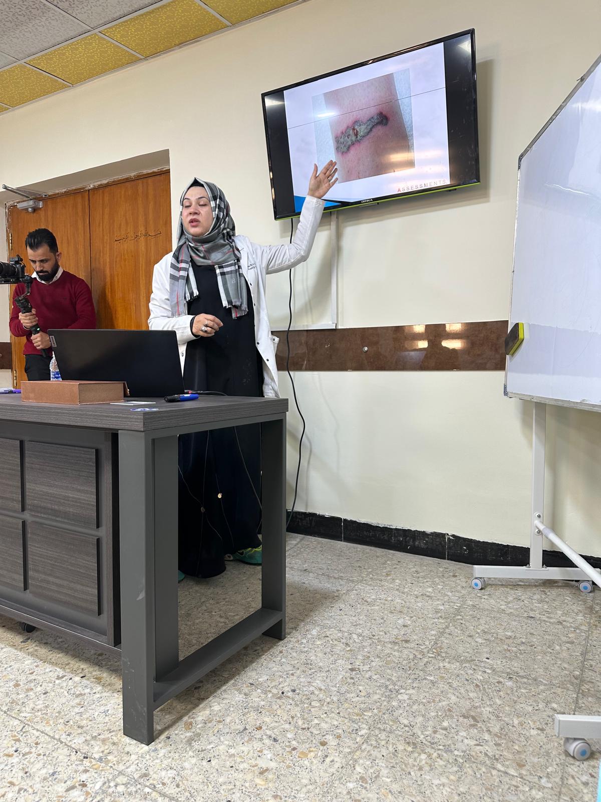 Dr. Rizvi teaching wound-care techniques to local clinicians