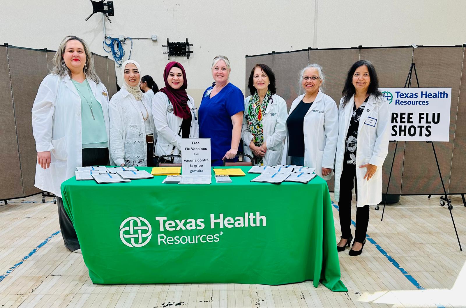 Dr. Rizvi with the physician team at the free flu-shot booth, in partnership with Texas Health Resources, at the October 11, 2025 Plano health fair