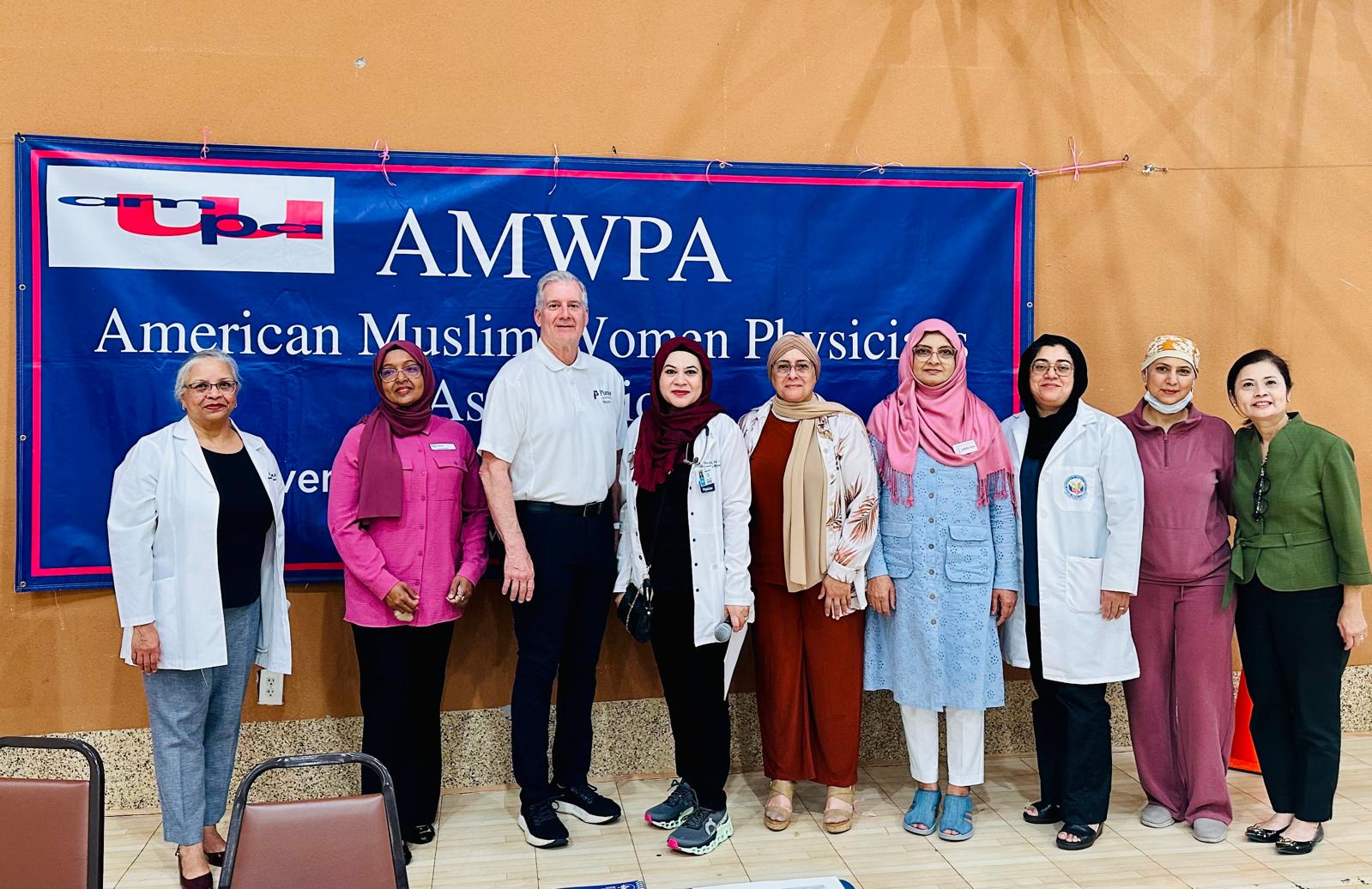 Mayor John B. Muns of Plano with Dr. Rizvi and the volunteer physician team at the October 11, 2025 health fair