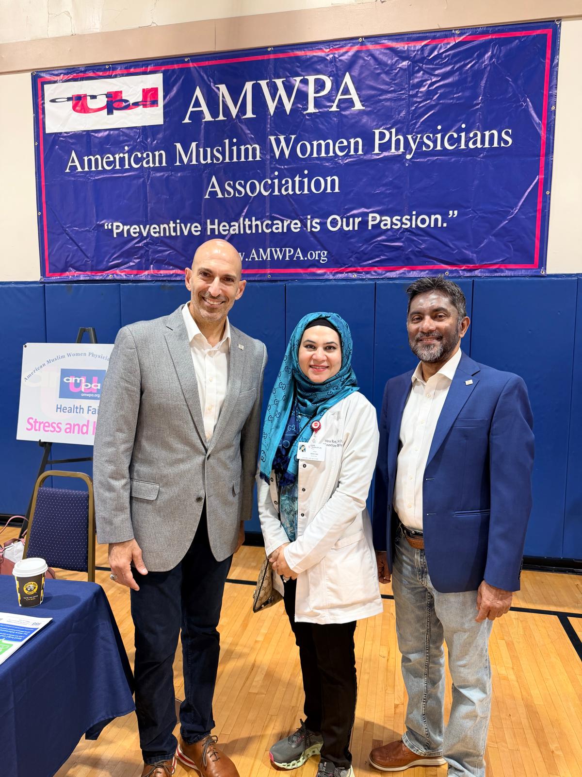 Richardson Mayor Amir Omar (left) and Council Member Shamsul Arefin (right) with Dr. Rizvi