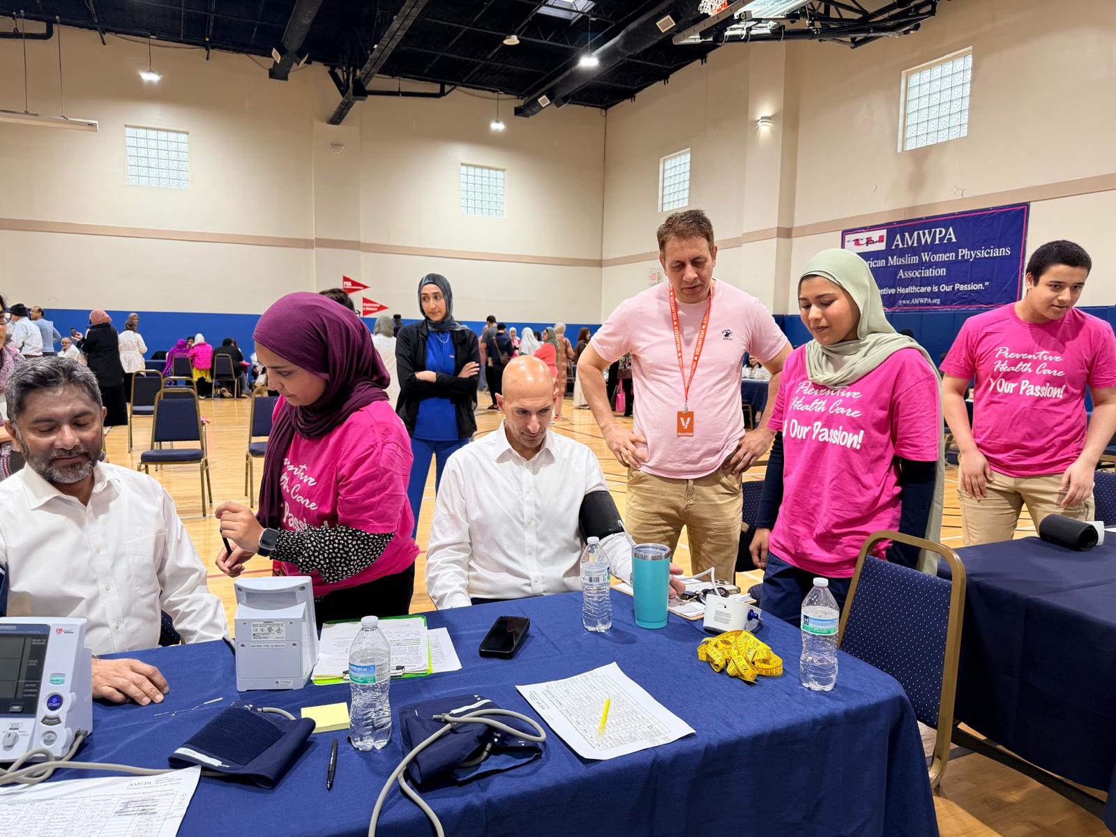Volunteers running free blood-pressure screenings at the April 4, 2026 Richardson Health & Wellness Fair